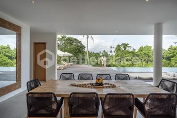 Curved Modernist Luxury Above Ubud's Jungle Canyon